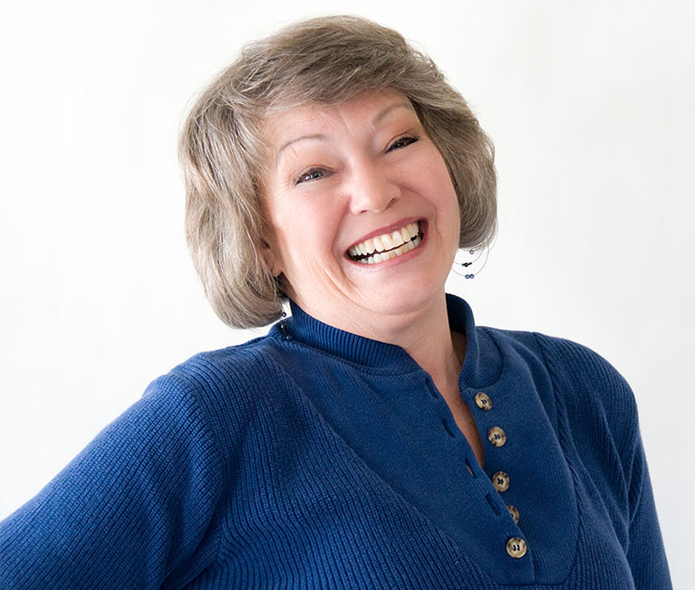Smiling cancer survivor at Park Meadows Breast Center