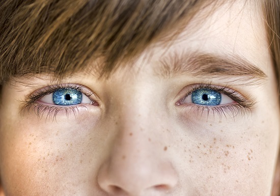 Person with clear blue eyes has good vision after getting LASIK