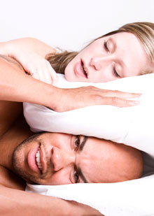 man can't sleep due to snoring woman