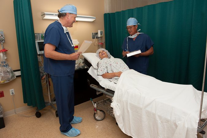 Dr. Wingate and Dr. Kim checking on patient