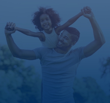 Child flying on father shoulders.