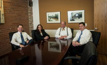 Lewis Kuhn Swan PC attorneys in conference room