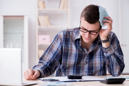 man struggling with insurance claim dispute
